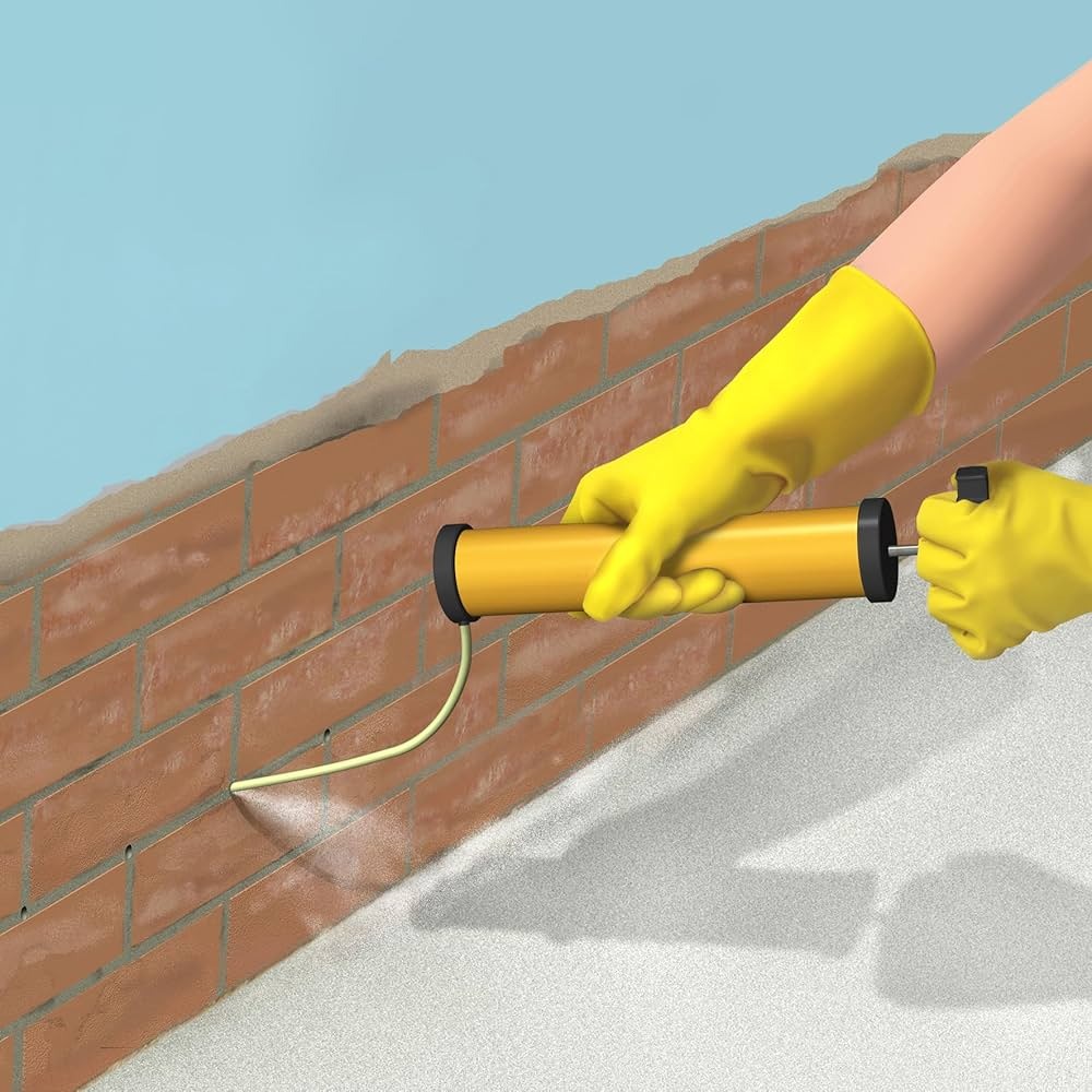 Injection de la crème dans un mur en brique